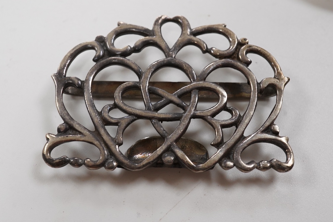 A small group of silver including an Edwardian miniature model of a throne by Edward Foligne Braham, Birmingham, 1901, 50mm, a small comport, one part of a belt buckle and three commemorative spoons, together with a gilt